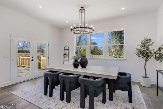 dining room with french doors, recessed lighting, wood finished floors, a chandelier, and baseboards