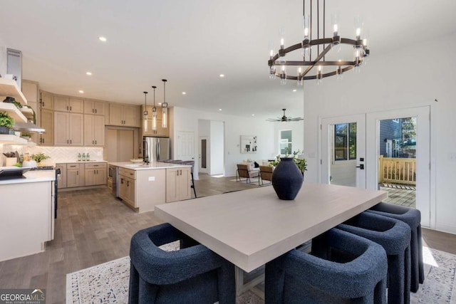 dining area featuring light wood-style floors, recessed lighting, and french doors