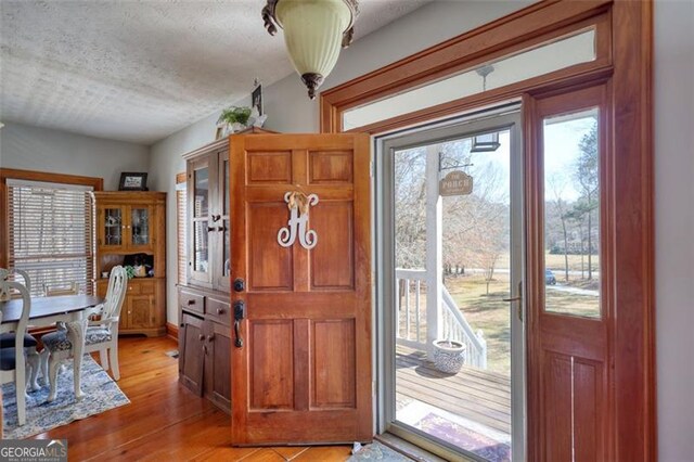 wooden terrace featuring french doors, grilling area, and central air condition unit