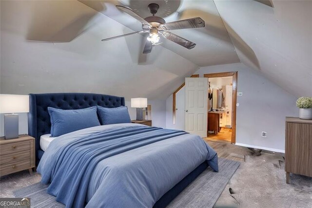 bedroom featuring a textured ceiling, visible vents, vaulted ceiling, and hardwood / wood-style floors