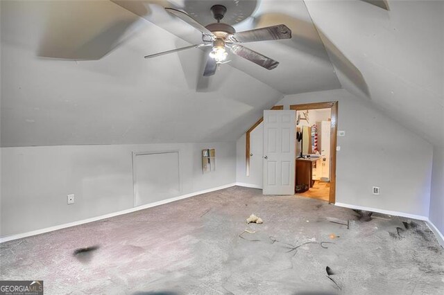 bedroom with lofted ceiling, baseboards, a ceiling fan, and carpet flooring