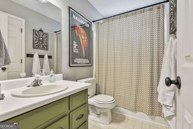 bathroom with toilet, tile patterned floors, and vanity