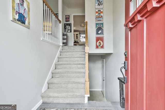 stairway featuring baseboards