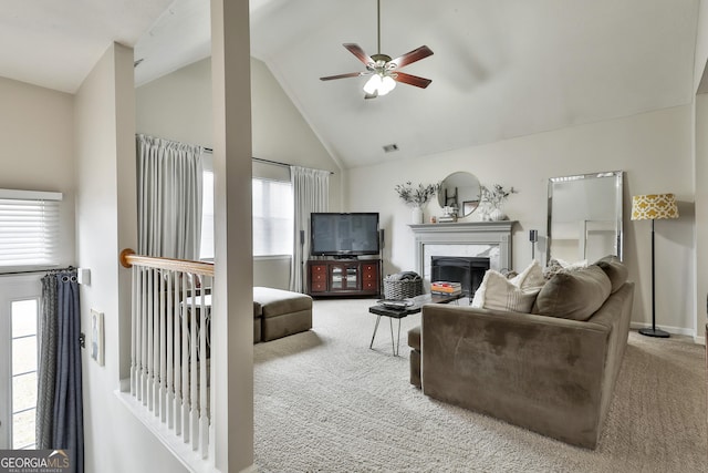 living area with carpet, a fireplace, high vaulted ceiling, and ceiling fan