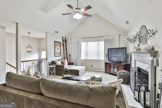 living room with high vaulted ceiling, light carpet, a fireplace, and visible vents