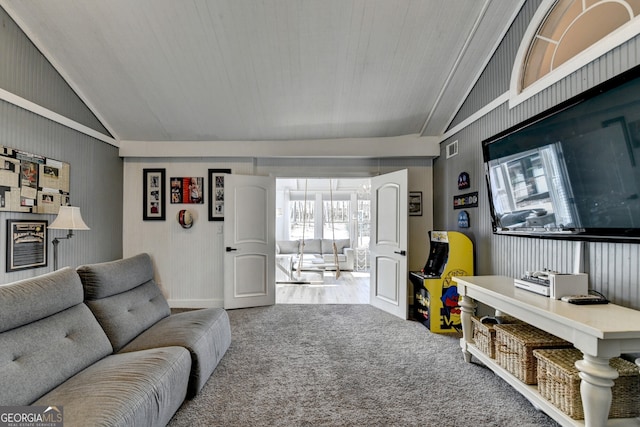 living area with lofted ceiling, visible vents, and carpet floors