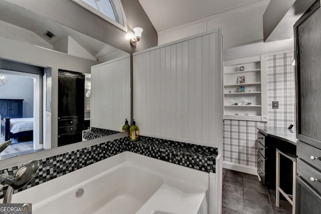 bathroom featuring lofted ceiling, tile patterned flooring, a garden tub, connected bathroom, and visible vents