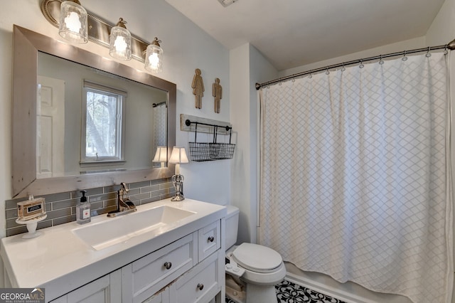 full bath featuring toilet, shower / bath combination with curtain, backsplash, and vanity