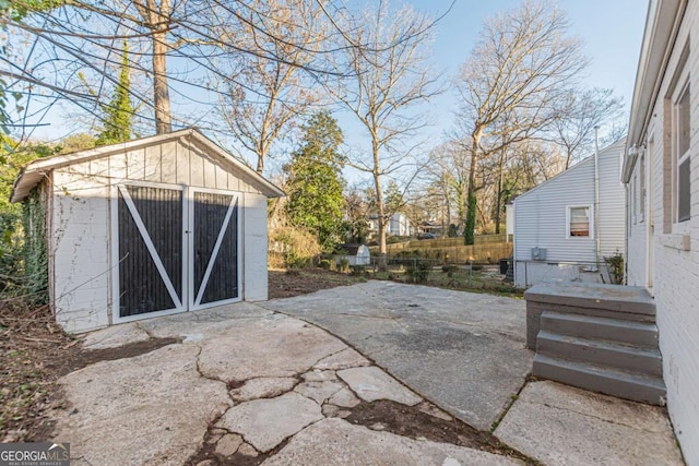 exterior space with fence and an outdoor structure