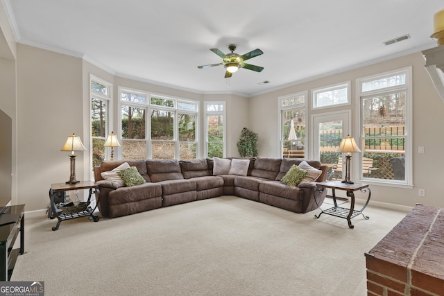 carpeted living room with ceiling fan, ornamental molding, visible vents, and baseboards