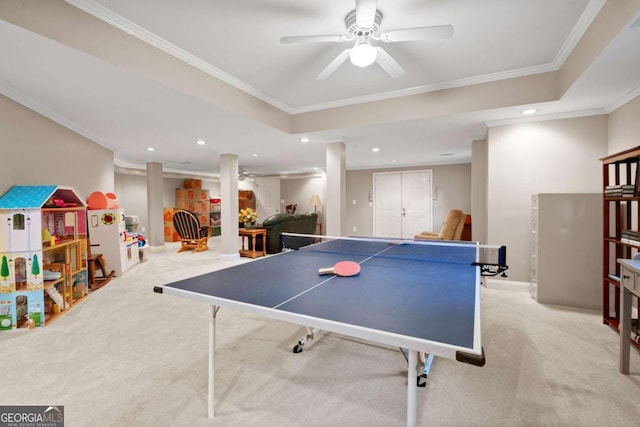 game room featuring recessed lighting, light colored carpet, a ceiling fan, a raised ceiling, and crown molding