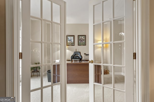 room details with ornamental molding, carpet flooring, and french doors