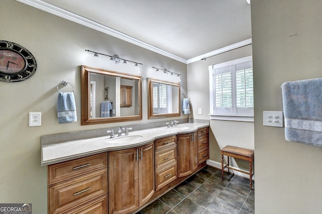 bathroom featuring crown molding, tile patterned flooring, a sink, and double vanity