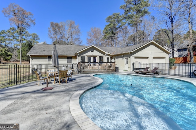 view of pool featuring a fenced in pool, fence, and a patio