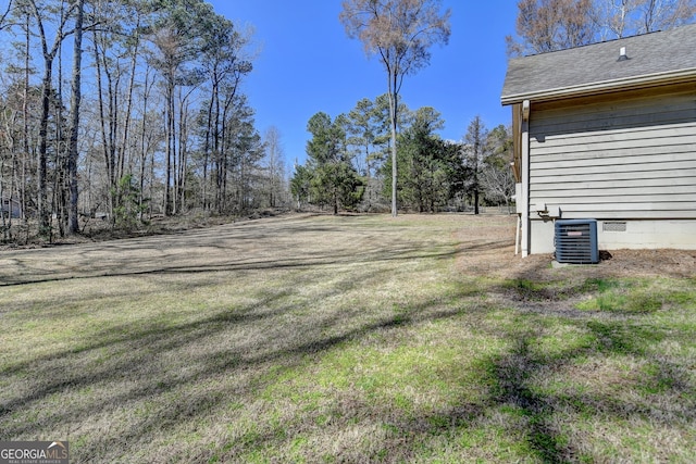 view of yard featuring central AC