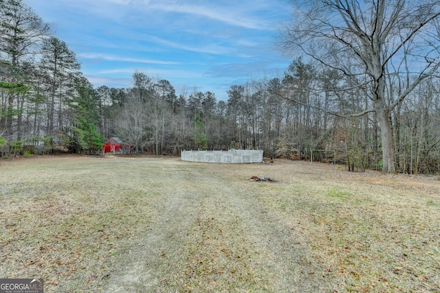 view of yard with a forest view