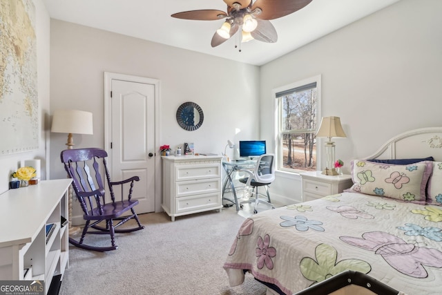 bedroom with ceiling fan and light colored carpet