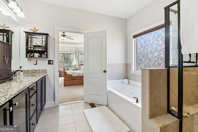 full bath featuring ensuite bath, ceiling fan, a garden tub, tile patterned flooring, and vanity