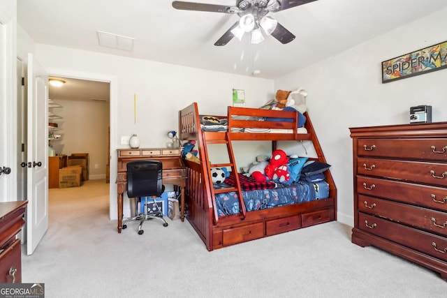 bedroom with a ceiling fan, carpet, and visible vents