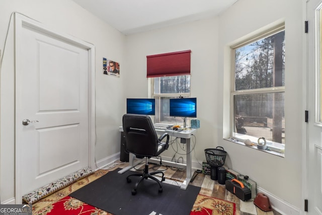 office area featuring wood finished floors and baseboards