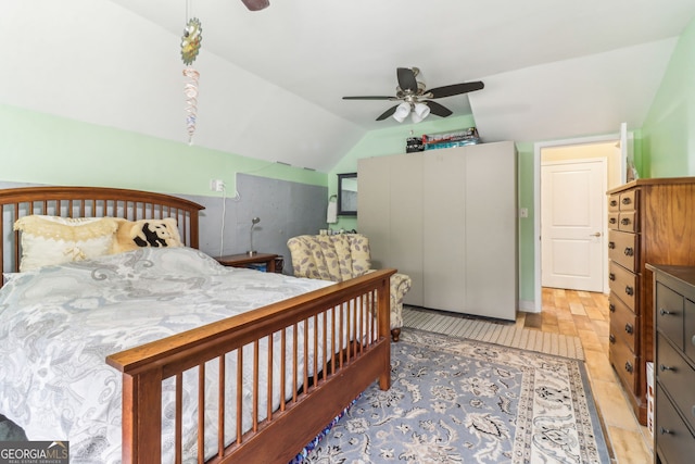 bedroom with lofted ceiling and ceiling fan