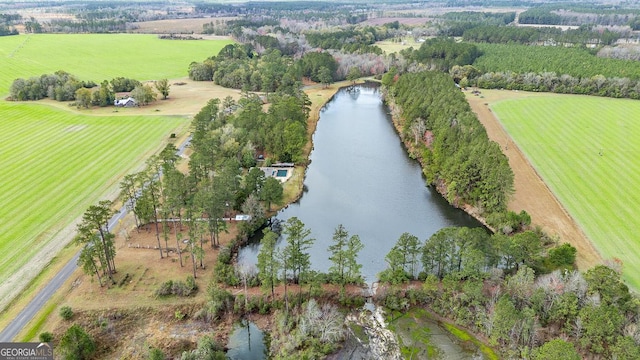 drone / aerial view featuring a water view and a rural view