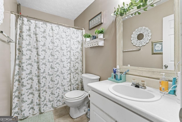 full bath with vanity, tile patterned floors, a textured ceiling, a shower with curtain, and toilet