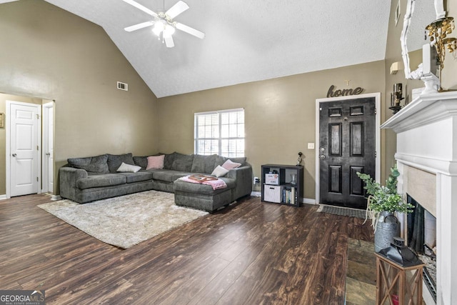 living room featuring visible vents, baseboards, a ceiling fan, and wood finished floors