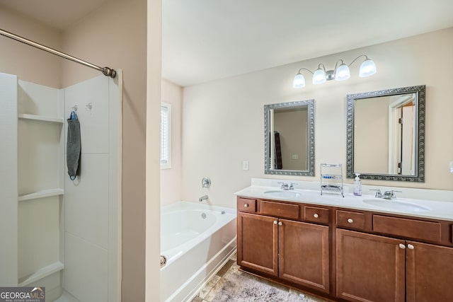 full bathroom with double vanity, a sink, and a bath