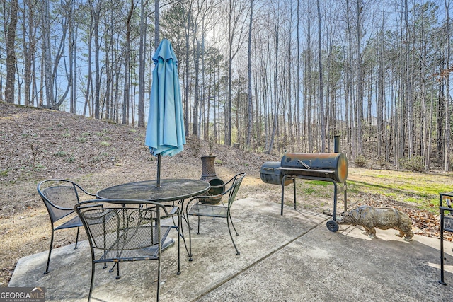 view of patio / terrace featuring outdoor dining space and grilling area