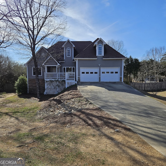 view of front of home featuring driveway and a garage