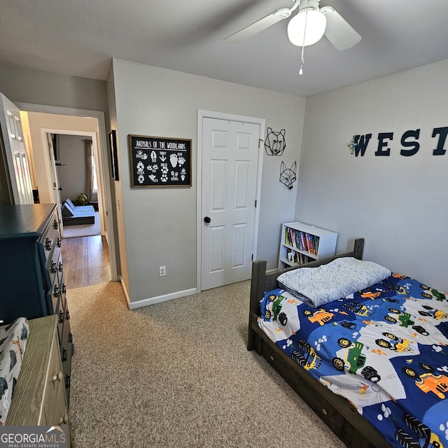 bedroom with carpet floors, a ceiling fan, and baseboards