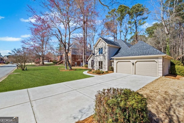 view of front facade featuring an attached garage, concrete driveway, a shingled roof, and a front yard