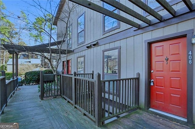 doorway to property featuring a wooden deck