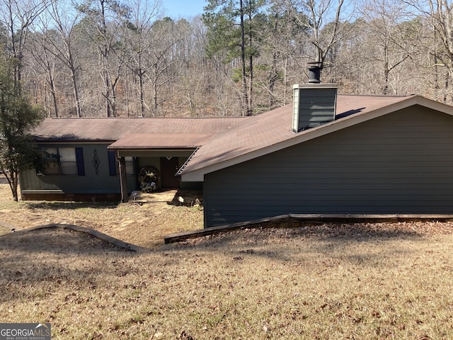 view of front of house featuring a chimney