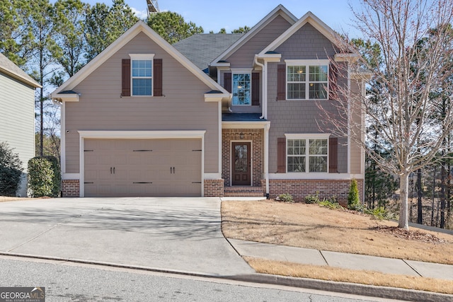 craftsman-style house with brick siding, driveway, and an attached garage