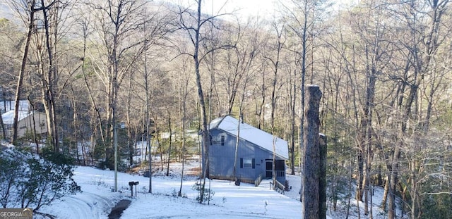 exterior space with a view of trees