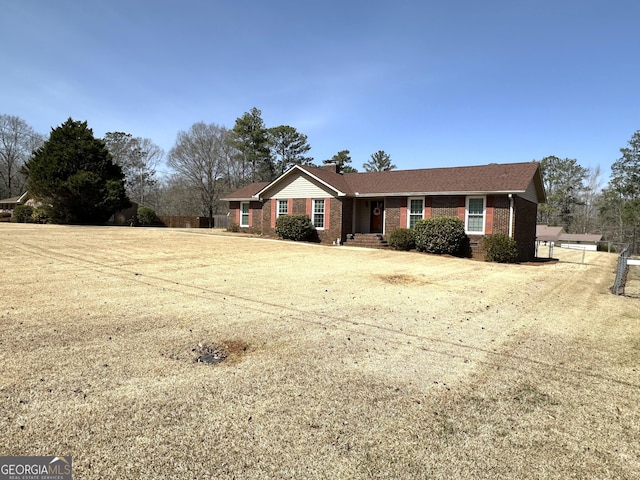 ranch-style house with brick siding