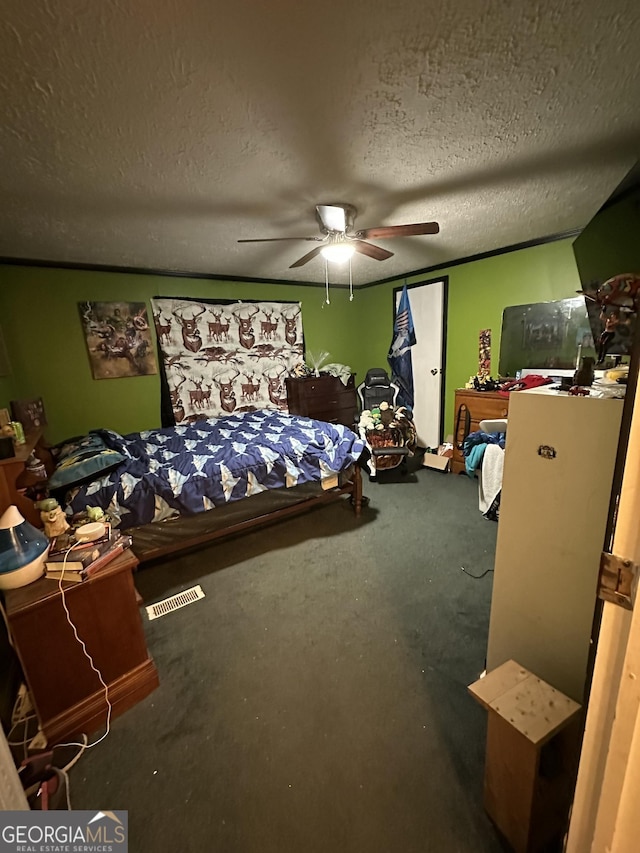 bedroom with a textured ceiling and ceiling fan