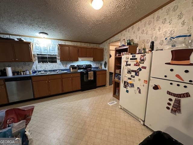 kitchen featuring lofted ceiling, black range with electric stovetop, freestanding refrigerator, dishwasher, and wallpapered walls