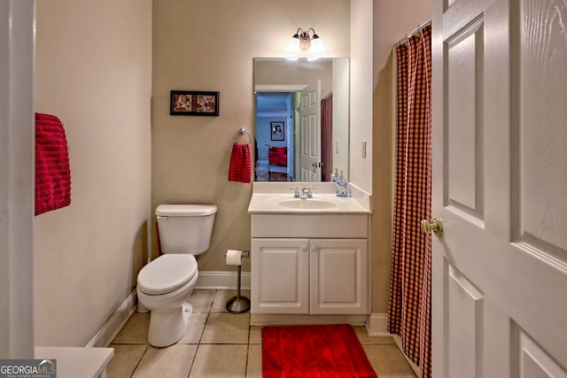 full bathroom with baseboards, vanity, toilet, and tile patterned floors