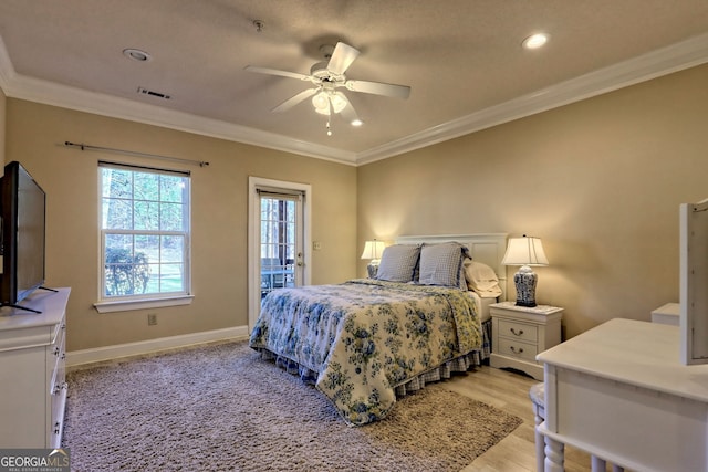 bedroom featuring access to outside, crown molding, visible vents, light wood-type flooring, and baseboards