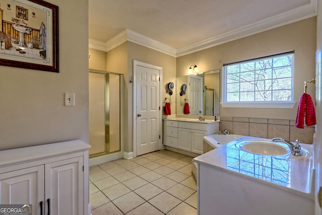 full bathroom featuring two vanities, ornamental molding, a sink, a shower stall, and tile patterned flooring