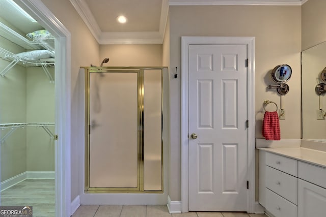 full bath featuring recessed lighting, vanity, baseboards, a shower stall, and crown molding