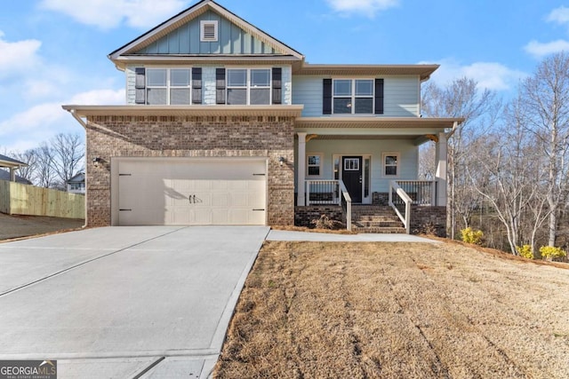 view of front of property with a garage, concrete driveway, a porch, board and batten siding, and brick siding