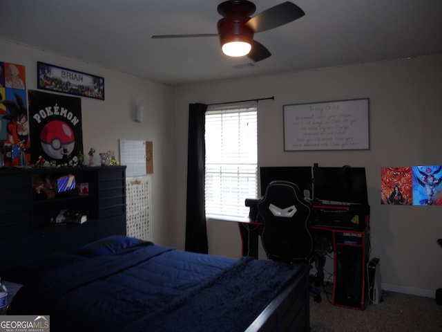 carpeted bedroom featuring ceiling fan and baseboards