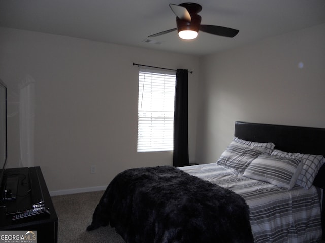 bedroom featuring ceiling fan, carpet floors, visible vents, and baseboards