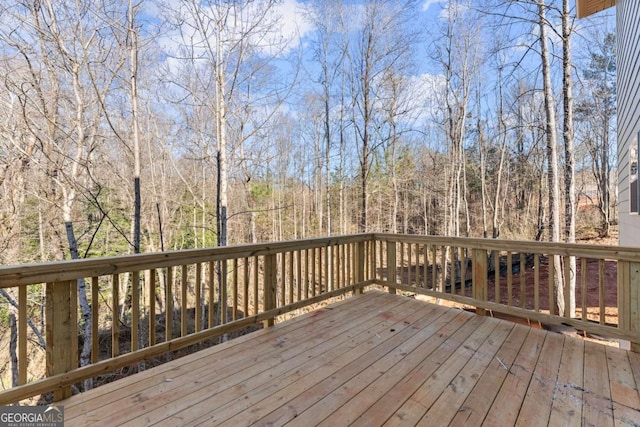 deck with a wooded view