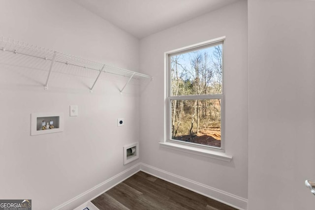 washroom featuring dark wood-style flooring, hookup for a washing machine, hookup for an electric dryer, laundry area, and baseboards