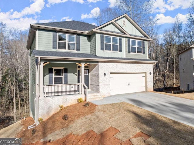 view of front of property featuring a garage, concrete driveway, covered porch, board and batten siding, and brick siding